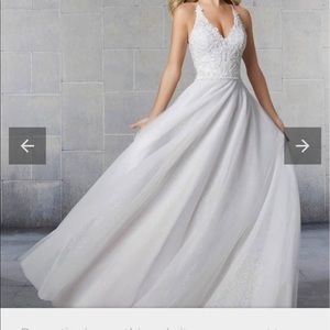 Ivory- size 12, hemmed to fit someone 5’4. The dress will need a cleaning.